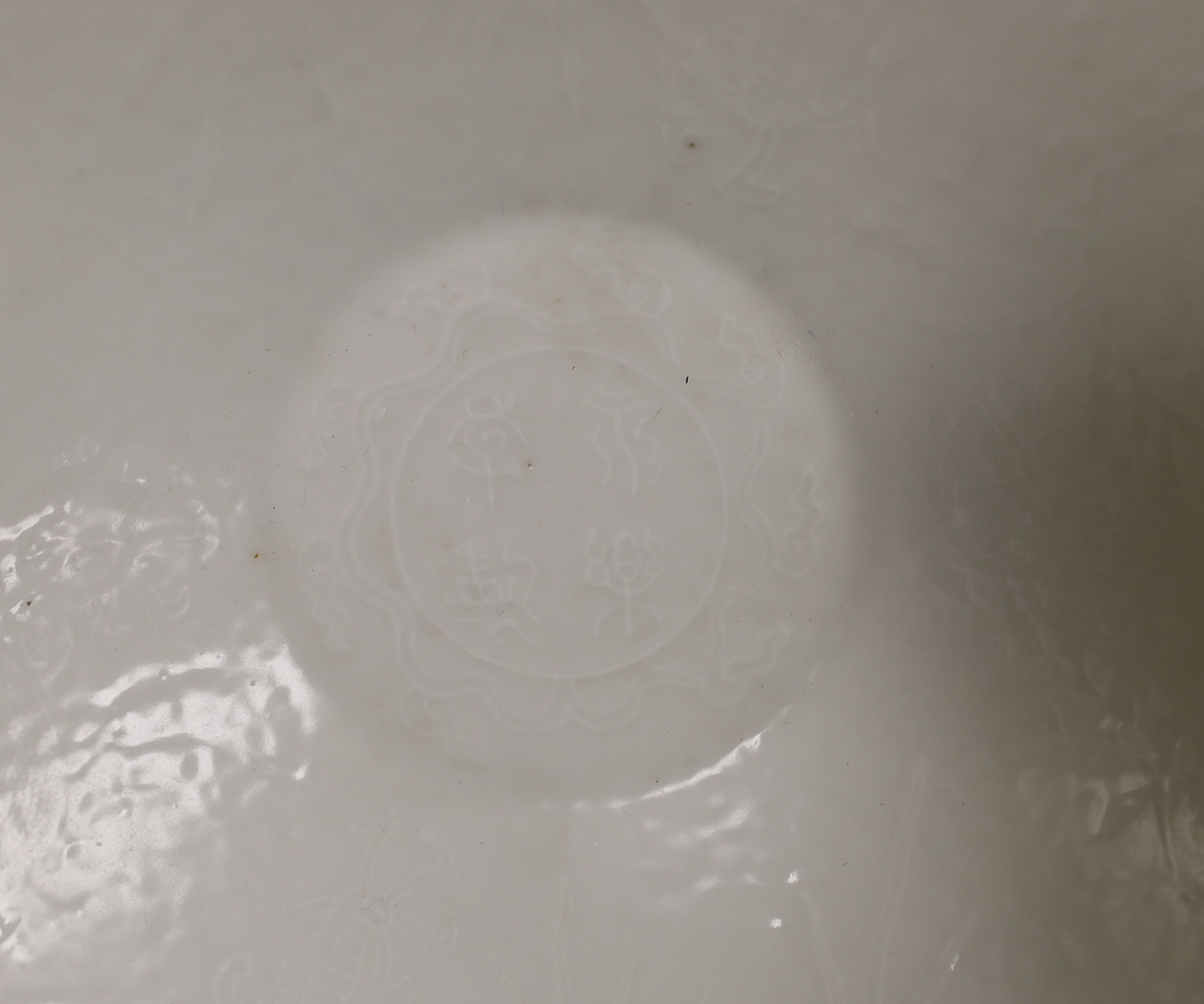 A Chinese white Anhua decorated conical dish, 20cm